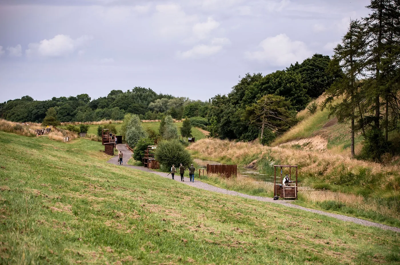 The clay ground: grass slopes, shooting stands and trees
